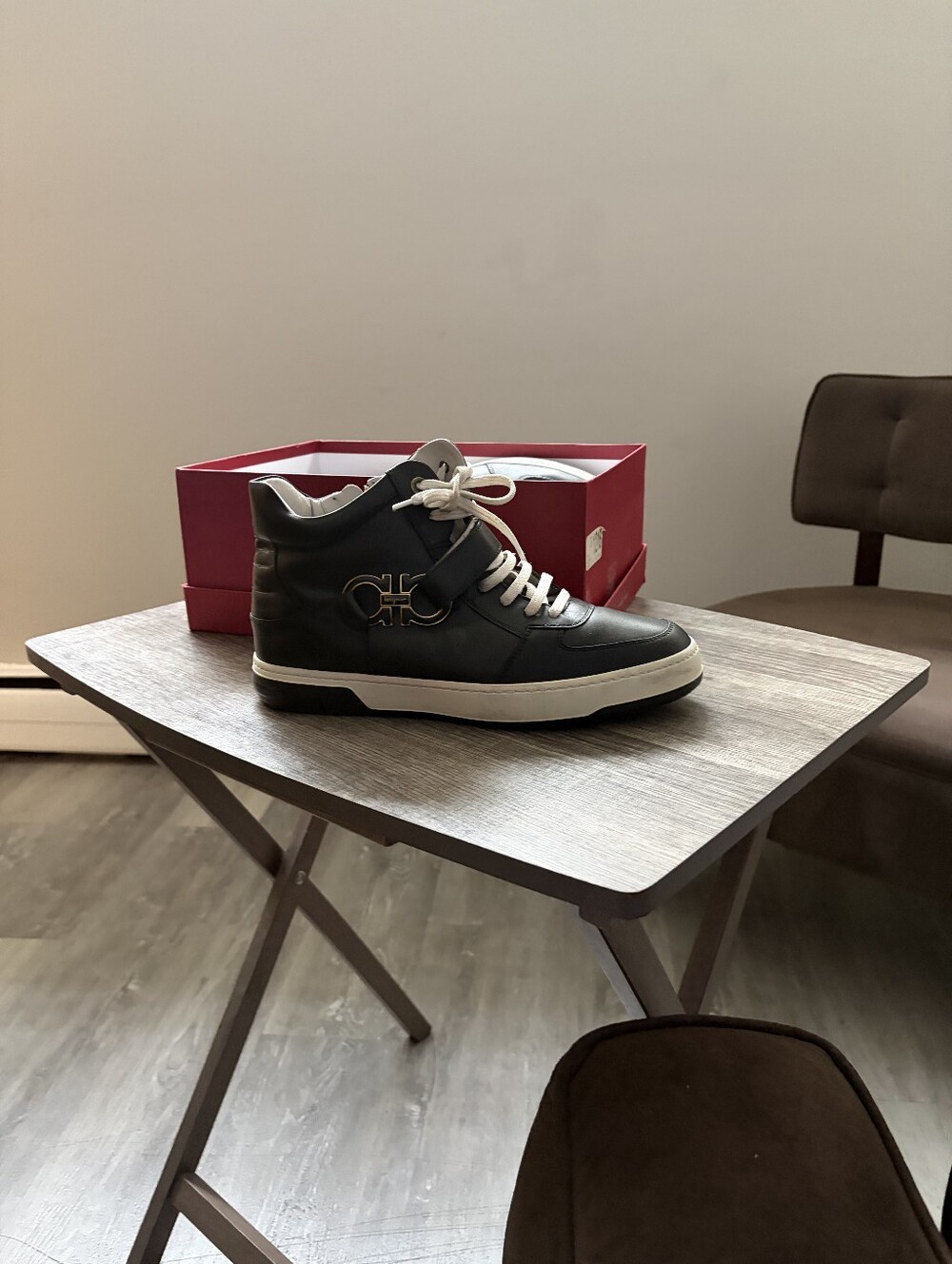 Men's Salvatore Ferragamo Black Leather High-Top Sneakers with White Accents.